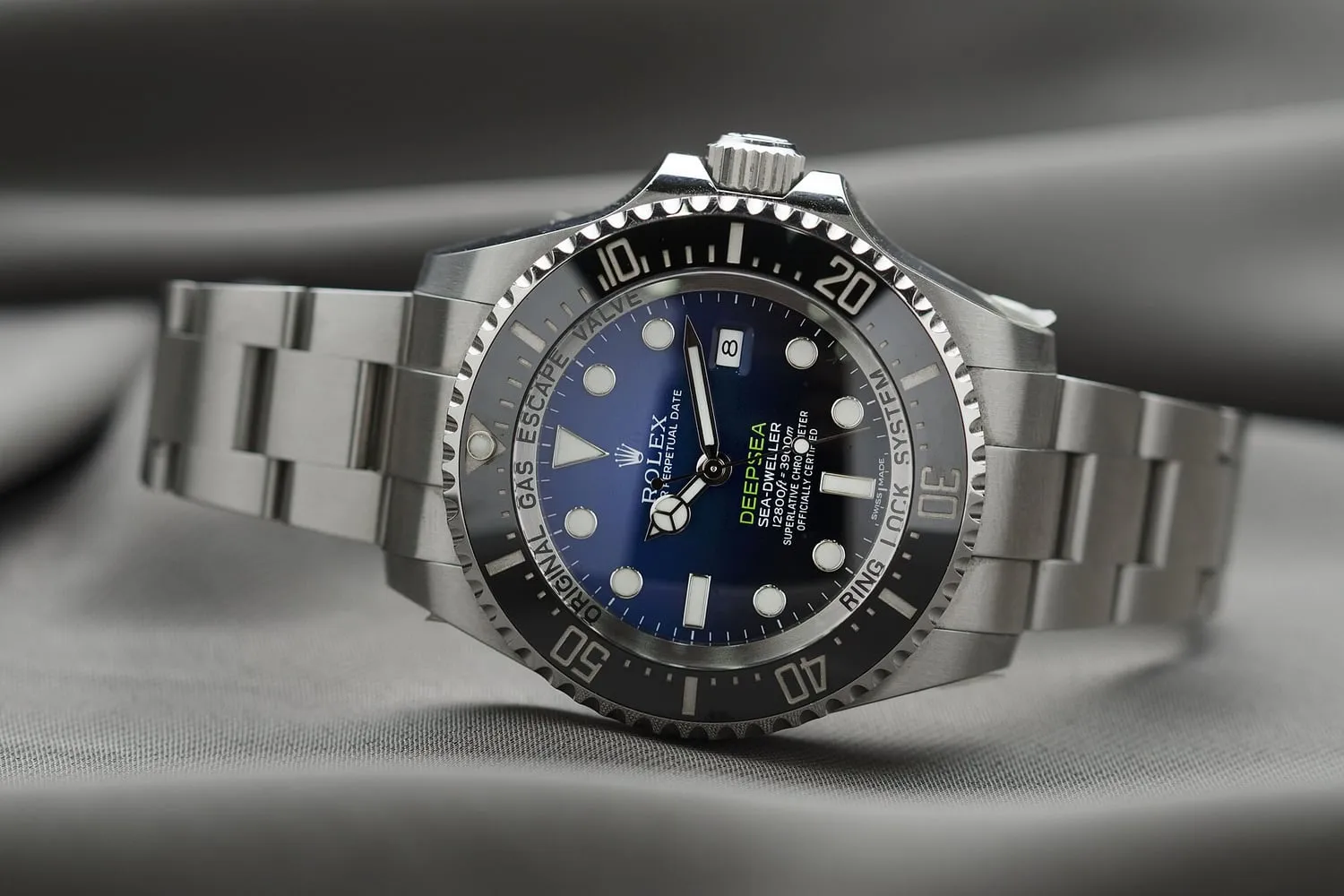 A stainless steel dive watch with a matching link bracelet