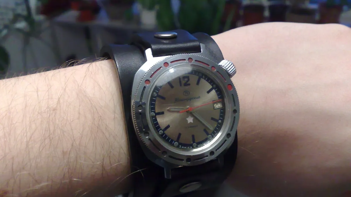 A wristwatch worn on a wrist, photographed from above
