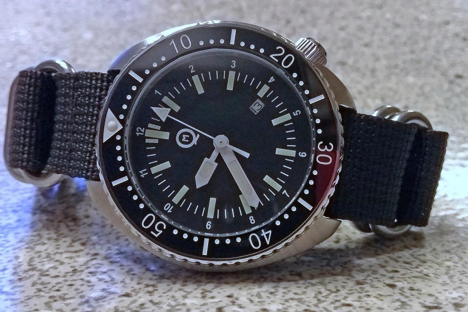 The crown and case side of a dive watch