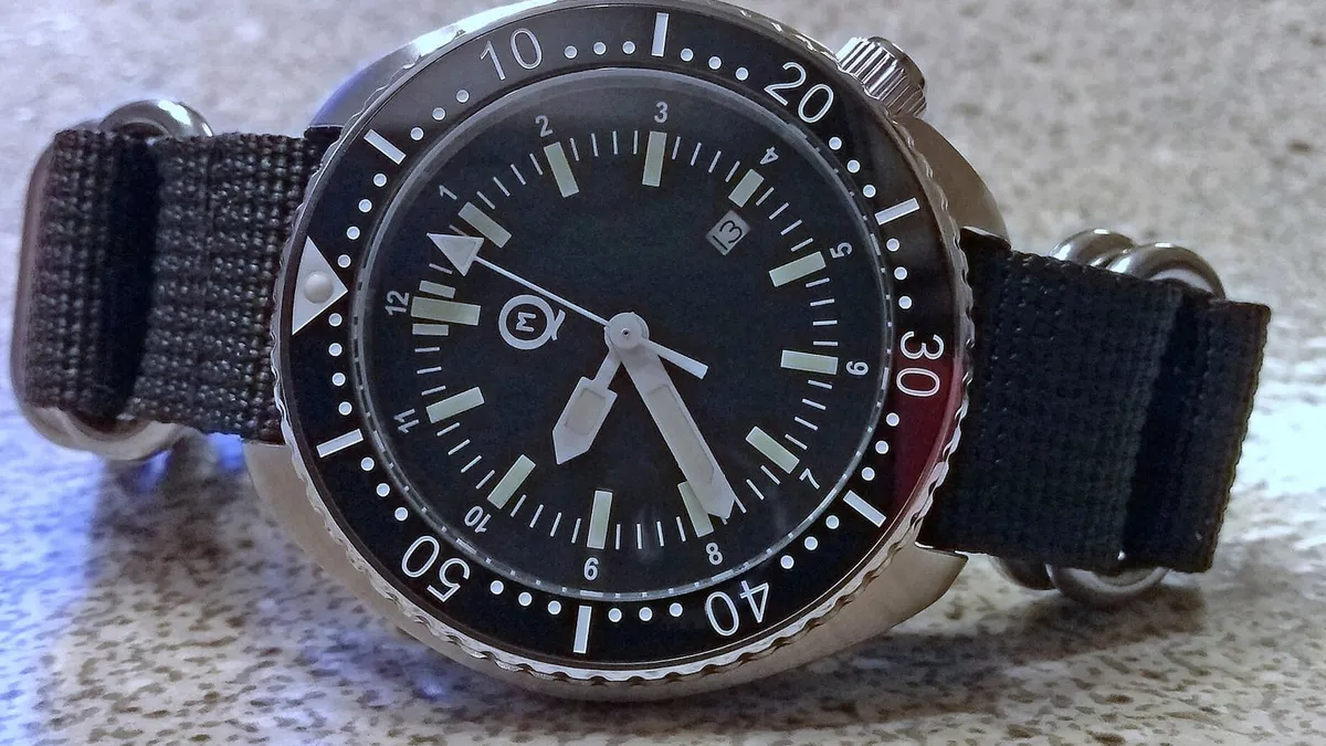 The crown and case side of a dive watch