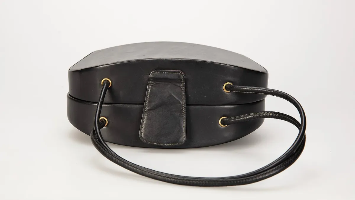 A leather handbag photographed against a plain background