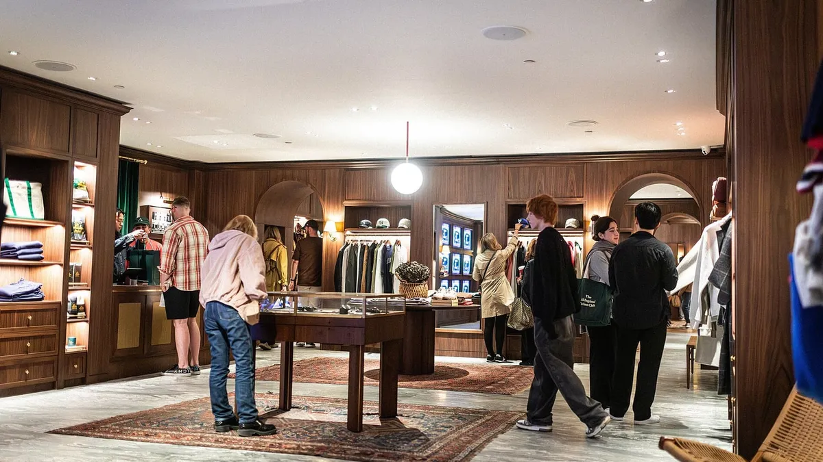 The interior of a luxury store, lit and merchandised