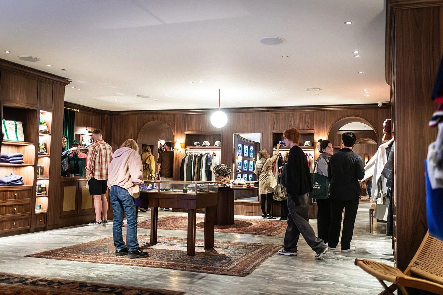 The interior of a luxury store, lit and merchandised